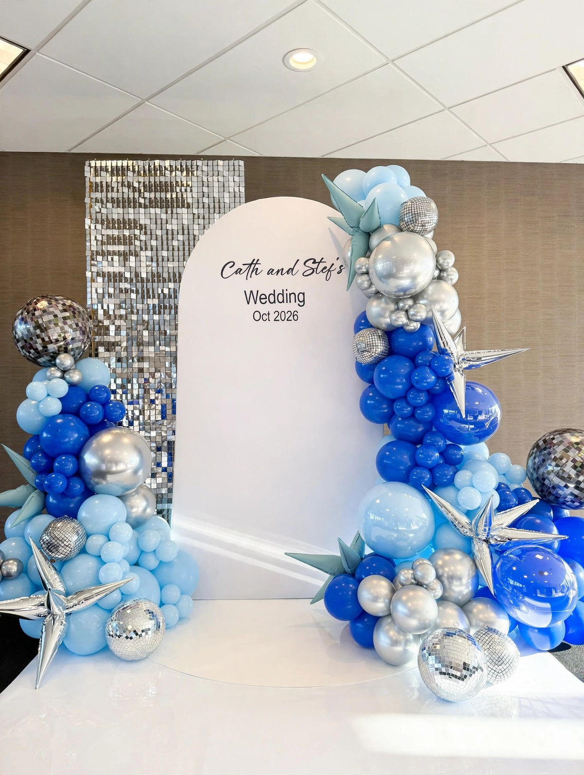 Blue and silver wedding backdrop with personalized arch panel