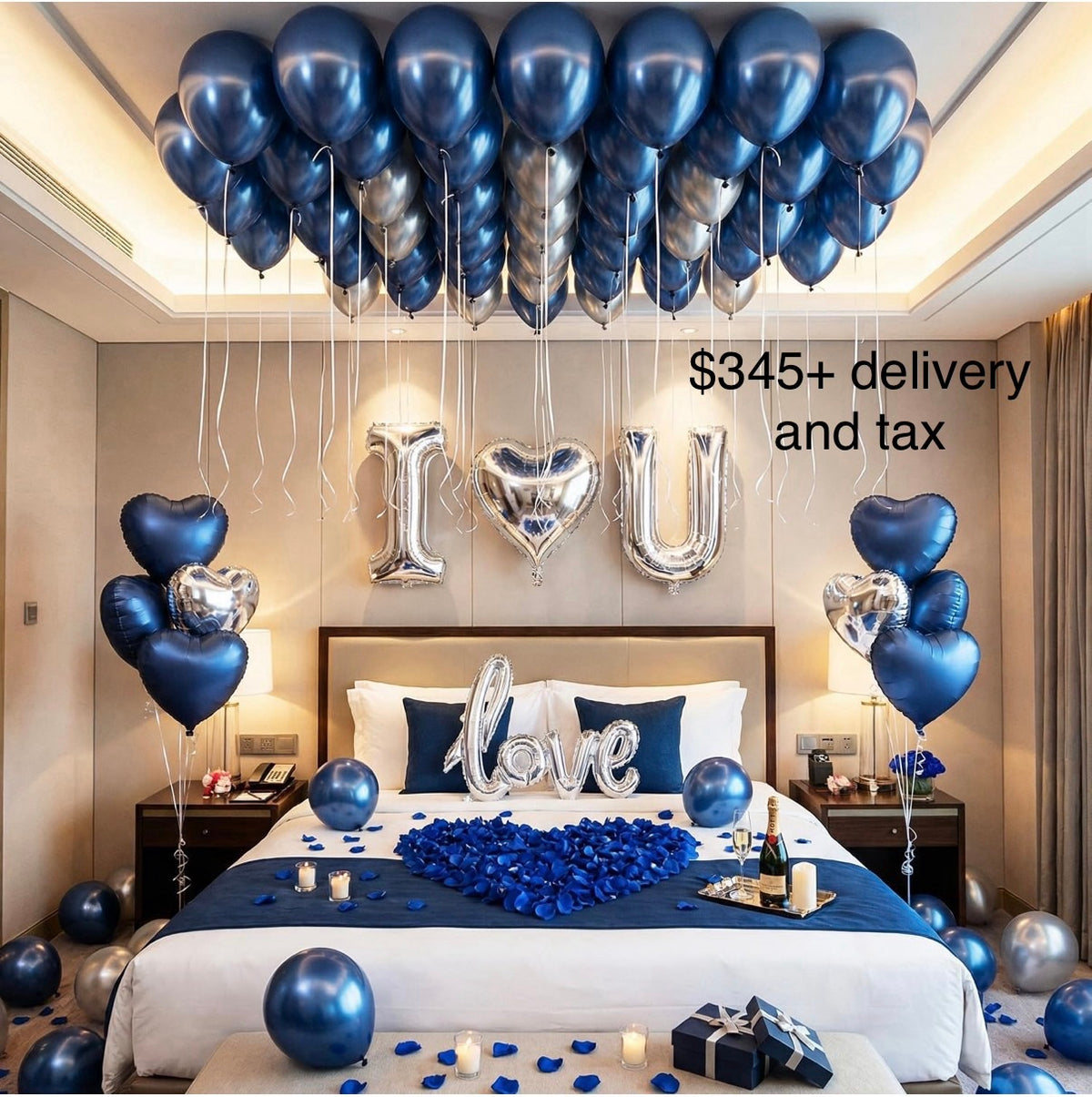 Romantic bedroom decorated with navy blue and silver helium balloons, I love you letter balloons, heart-shaped blue rose petals and candles on the bed