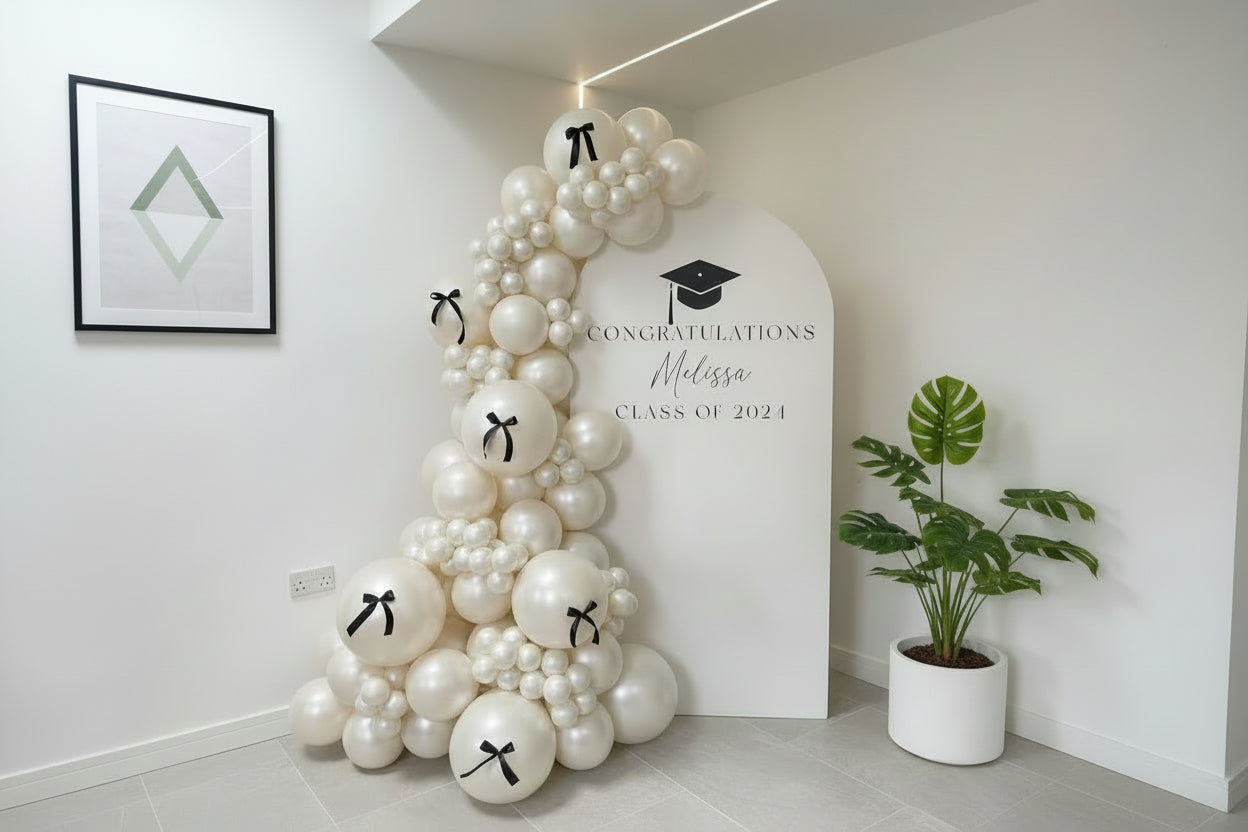 Elegant White Graduation Photo Backdrop with Balloon Garland & Custom Text