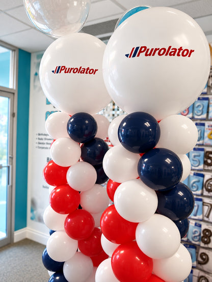 Close-up of classic spiral balloon columns / pillars with Purolator logo topper balloons