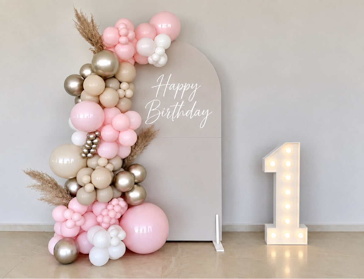 Blush pink happy birthday balloon backdrop with light-up number one