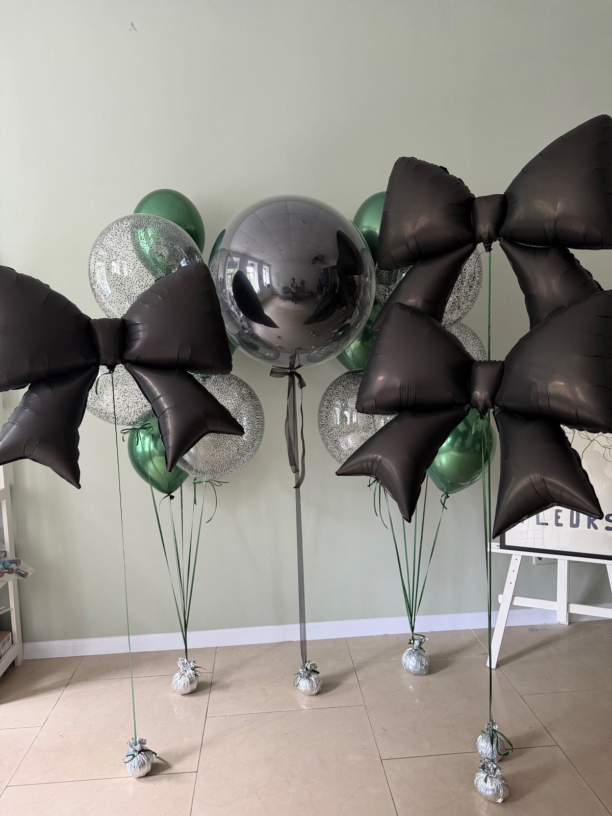 Green, black and silver birthday bouquet with giant black bows