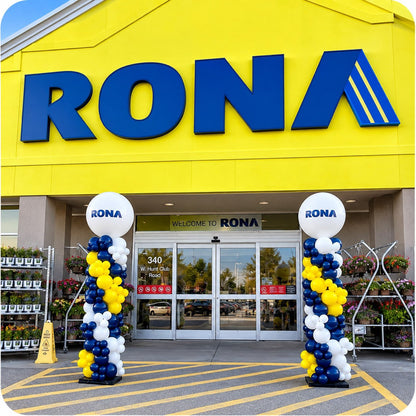 Two organic balloon columns / pillars with RONA logo toppers flanking a RONA store entrance