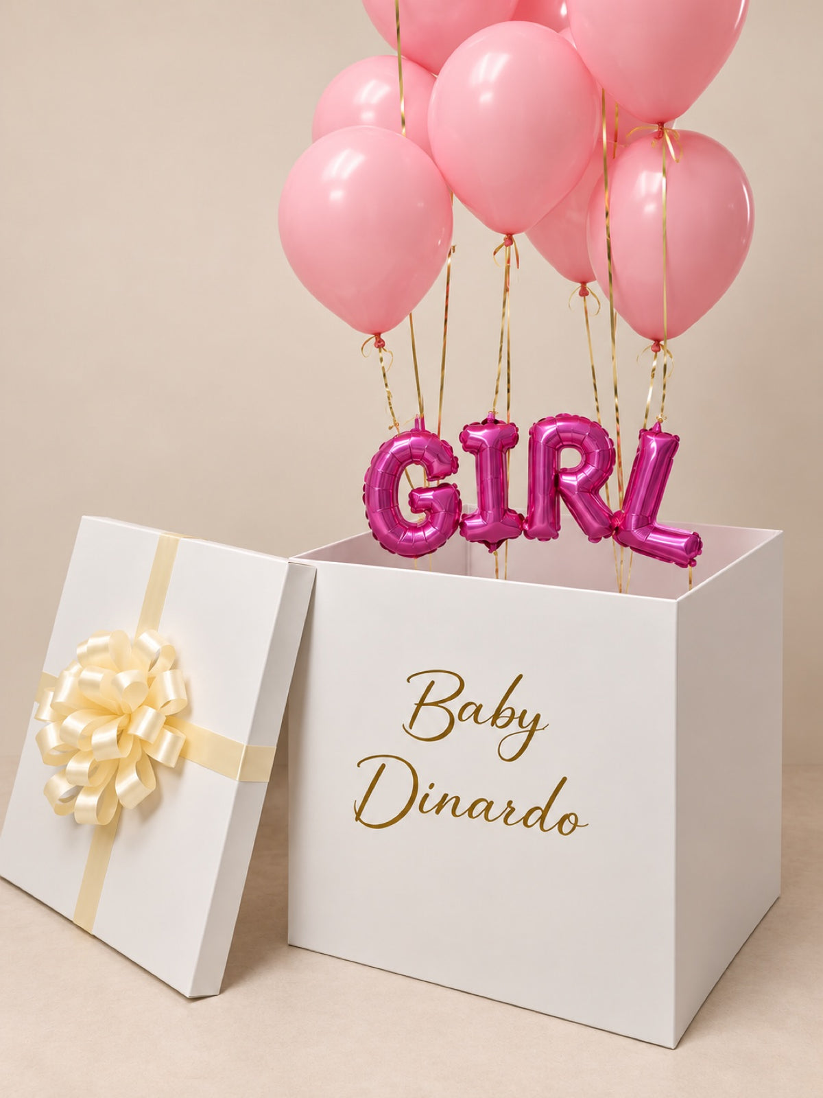 Gender reveal surprise balloon box close-up with pink GIRL foil letters