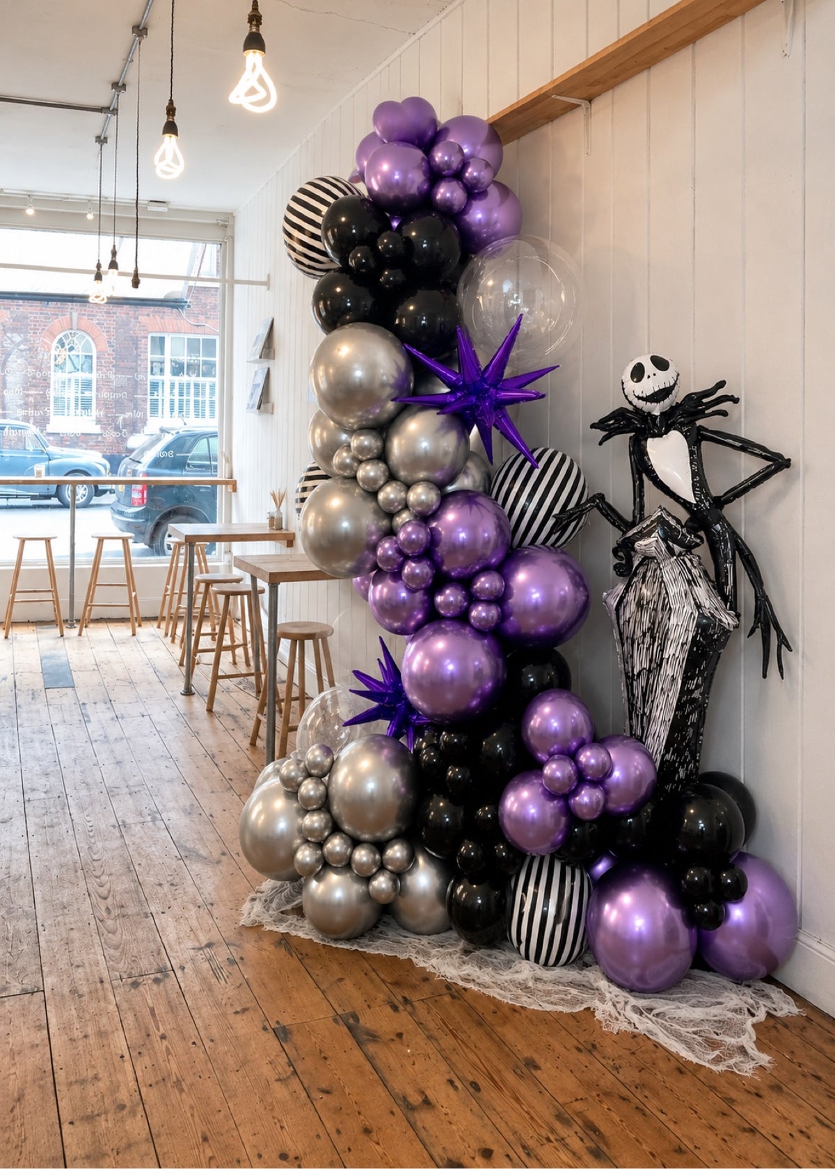 Purple black and chrome Halloween balloon garland with skeleton foil figure