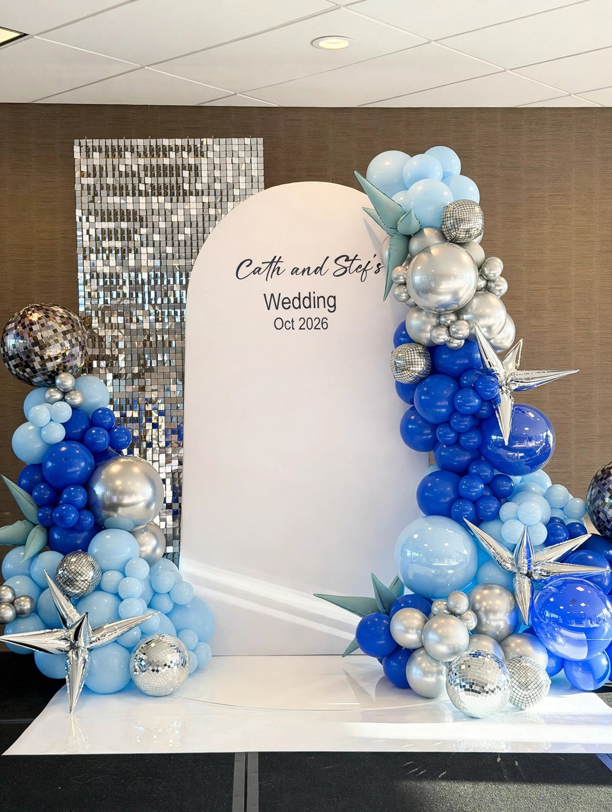 Blue and silver wedding balloon backdrop with shimmer wall, full view